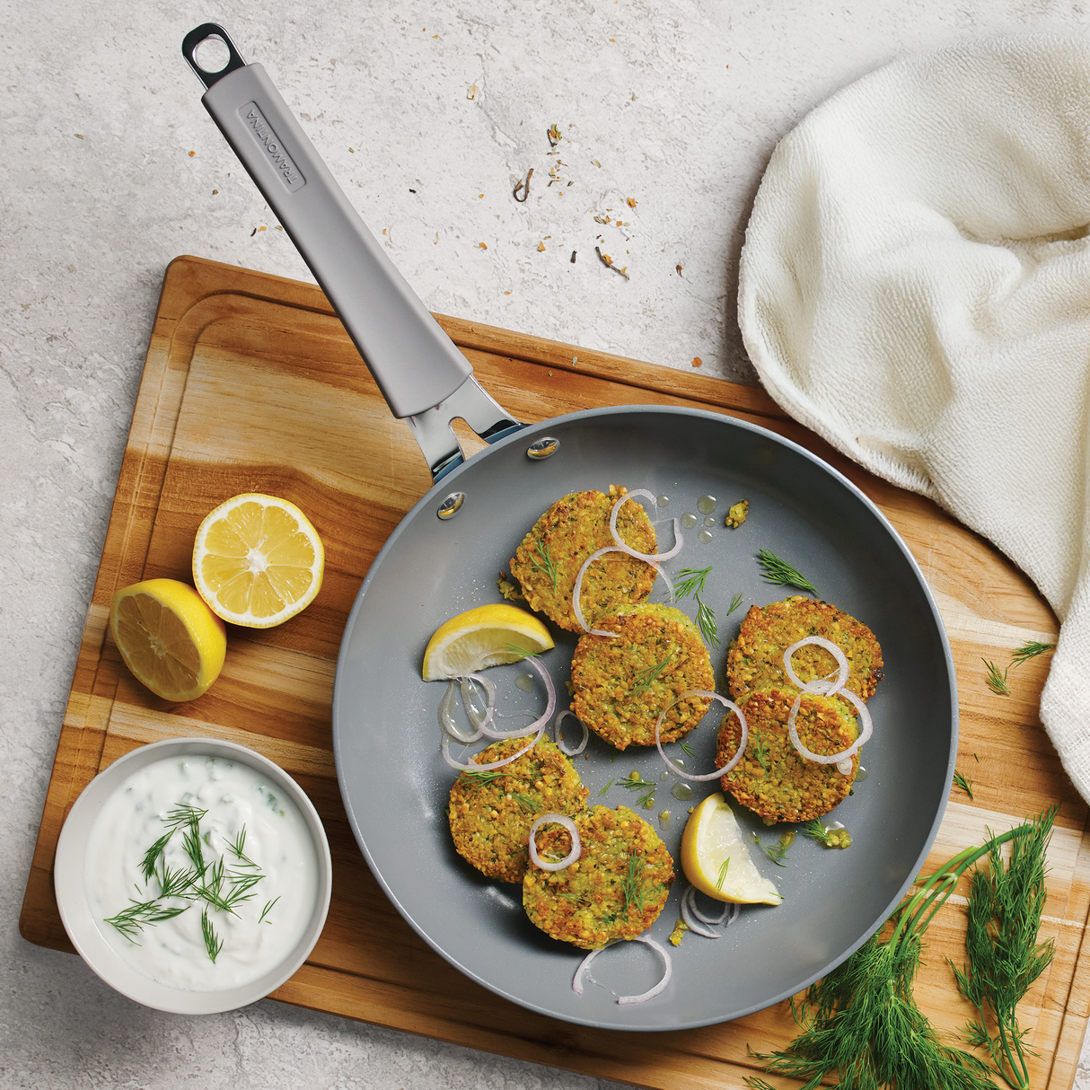 Blue Tramontina India Stella 20 cm fry pan with non-stick coating, ideal for sautéing and cooking on stovetops.