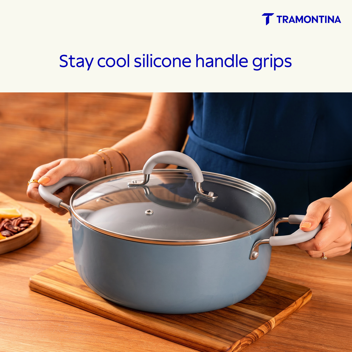 Blue Tramontina Stella Biryani Pot, 24 cm, with sturdy handles and a polished finish, ideal for flavorful biryani cooking.