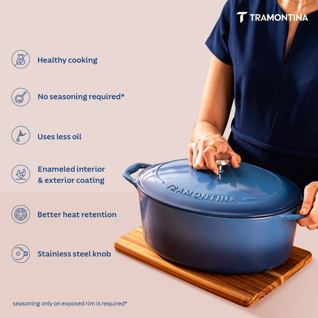 Tramontina India Bestow enameled cast iron oval Dutch oven in medium blue, 6.6L capacity, suitable for baking and braising.