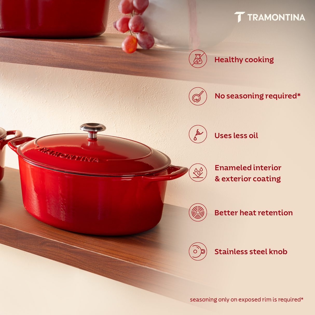 Tramontina India Bestow enameled cast iron oval Dutch oven in gradated red, 6.6L, with a glossy finish and sturdy handles.