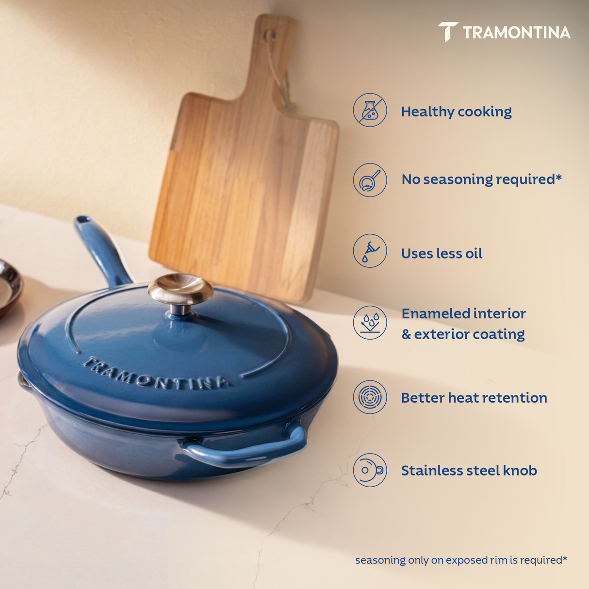 Tramontina India Bestow enameled cast iron 25cm blue fry pan with lid, showcasing its durable, colorful cooking surface and sturdy handle.