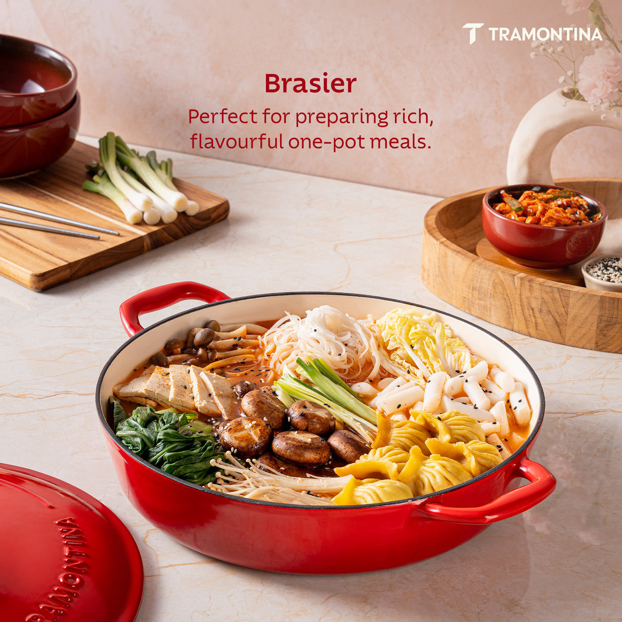 Tramontina India Bestow enameled cast iron round braiser in gradated red, 3.8L, with a smooth, glossy finish and sturdy handles.