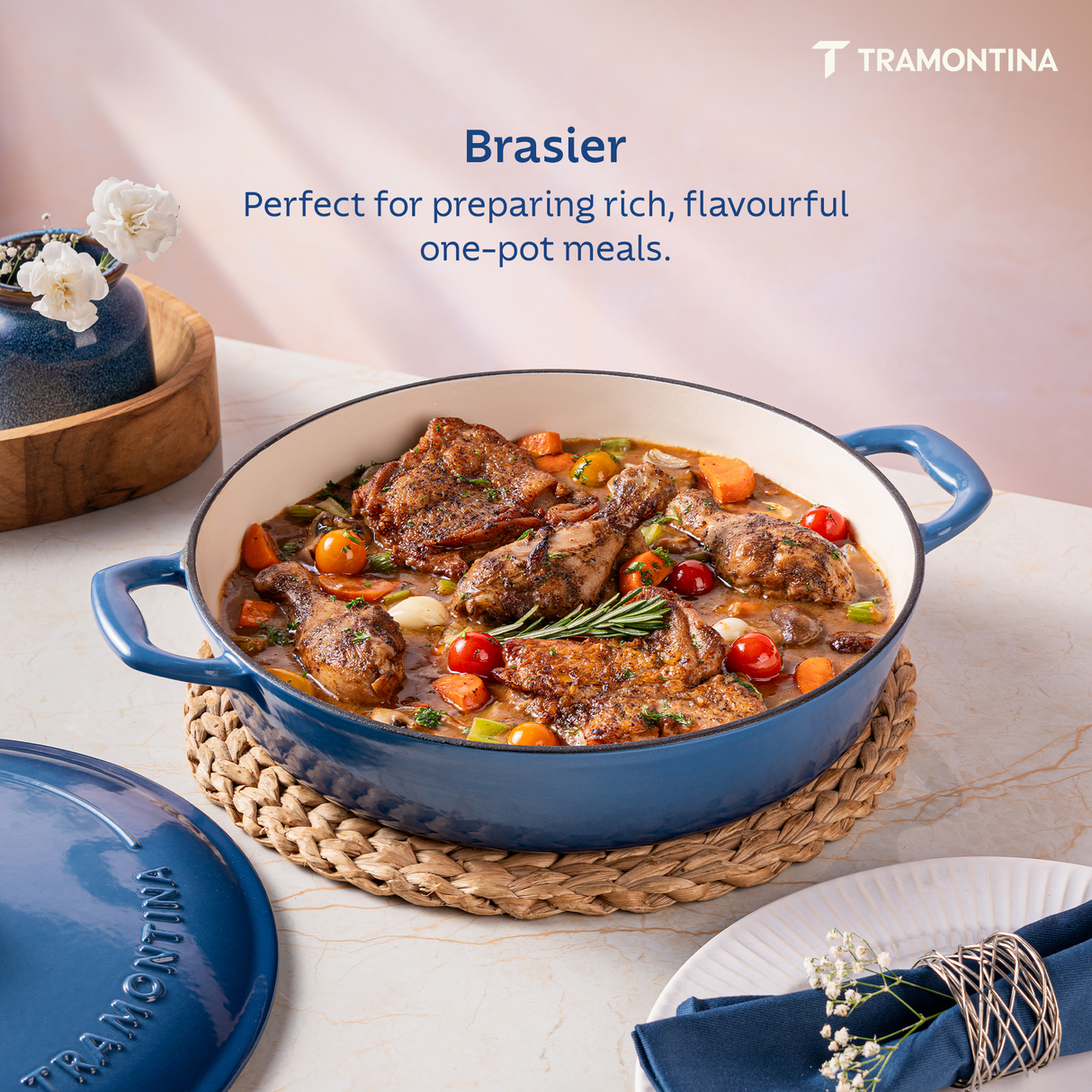 Tramontina India Bestow enameled cast iron round braiser in medium blue, 3.8L capacity, with a glossy enamel finish.