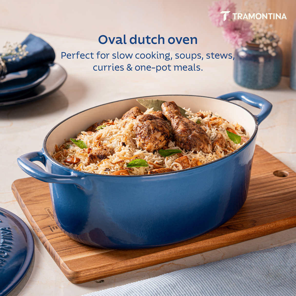 Tramontina India Bestow enameled cast iron oval Dutch oven in medium blue, 5.2L capacity, ideal for cooking and baking.
