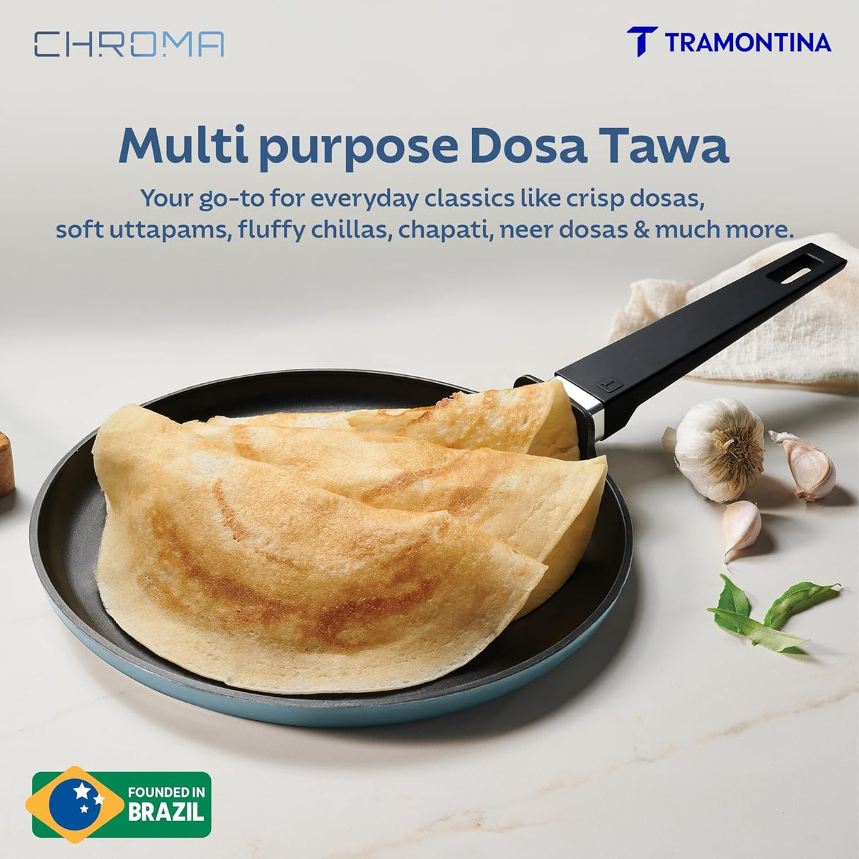 Tramontina India Chroma Dosa Tawa in blue, 28 cm, showcasing its flat surface and sturdy handle for cooking dosa.