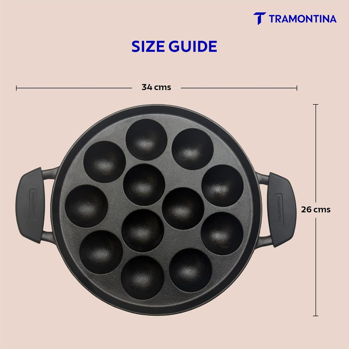 Tramontina India 26cm pre-seasoned cast iron paniyaram pan with 12 pits for making traditional Indian snacks.