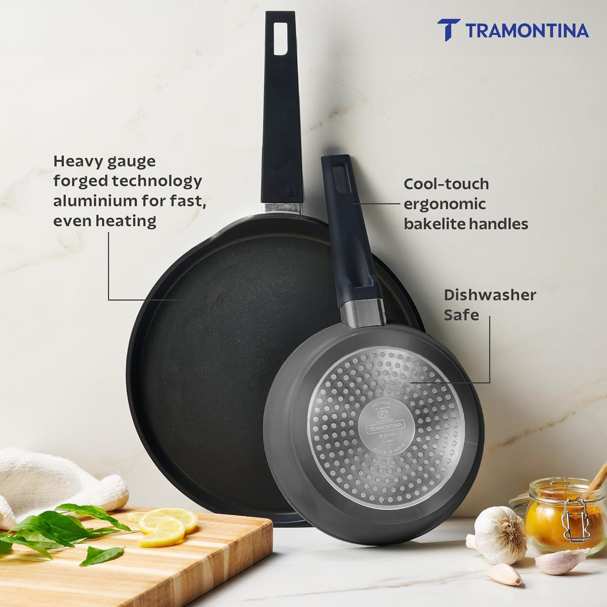 Tramontina India Chroma Forged cookware set featuring a 20cm fry pan and 28cm DosaTawa in grey, with sturdy handles.