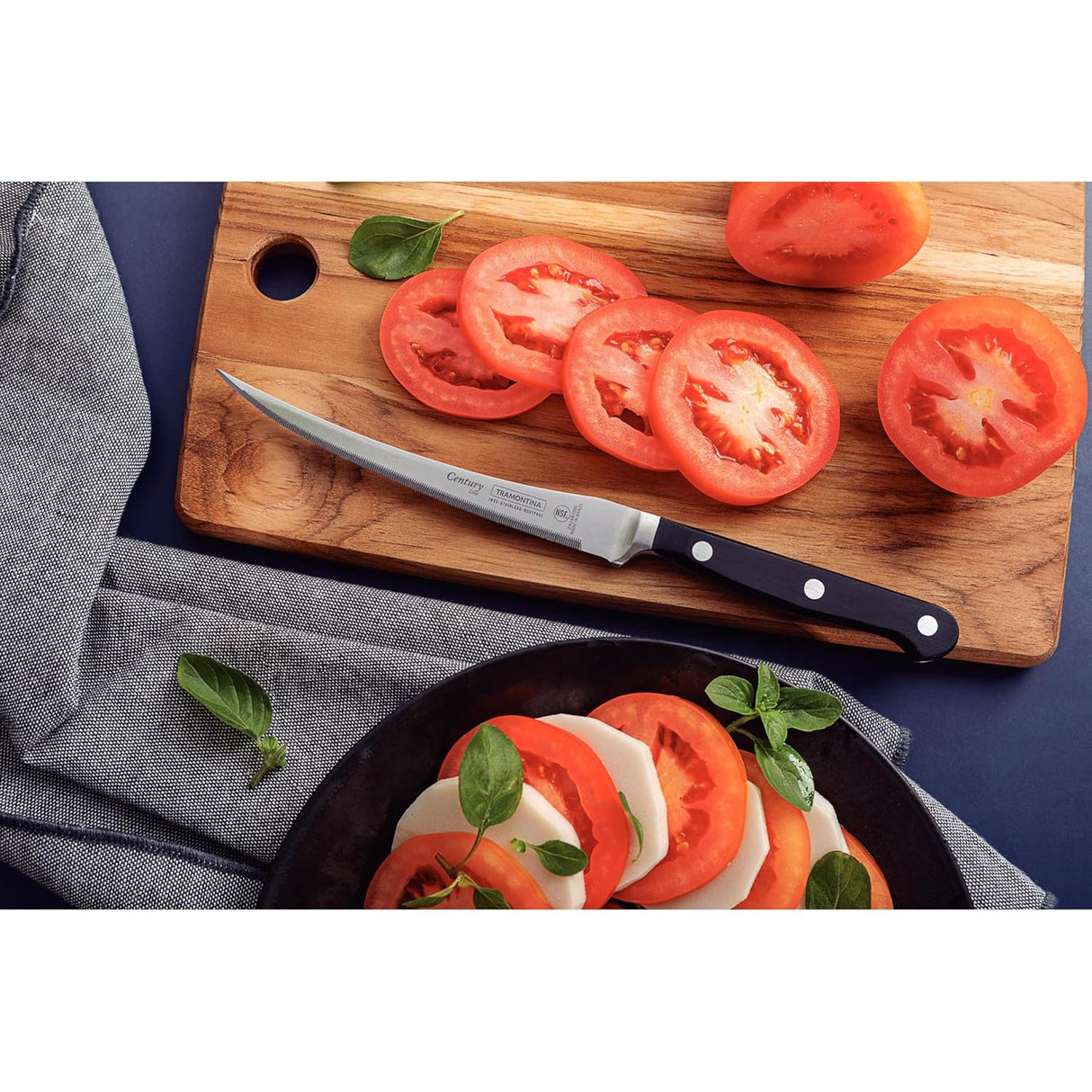 Tramontina India Century stainless steel tomato knife, 5-inch blade, designed for precise slicing of tomatoes and soft fruits.