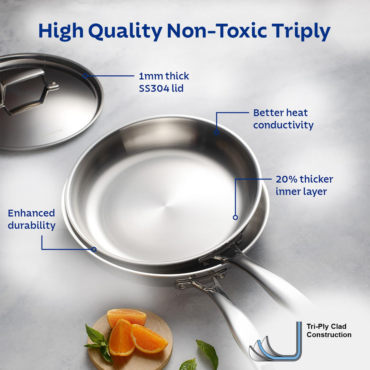Tramontina India Aeion 26cm stainless steel tri-ply fry pan with stainless steel lid on a wooden kitchen countertop.