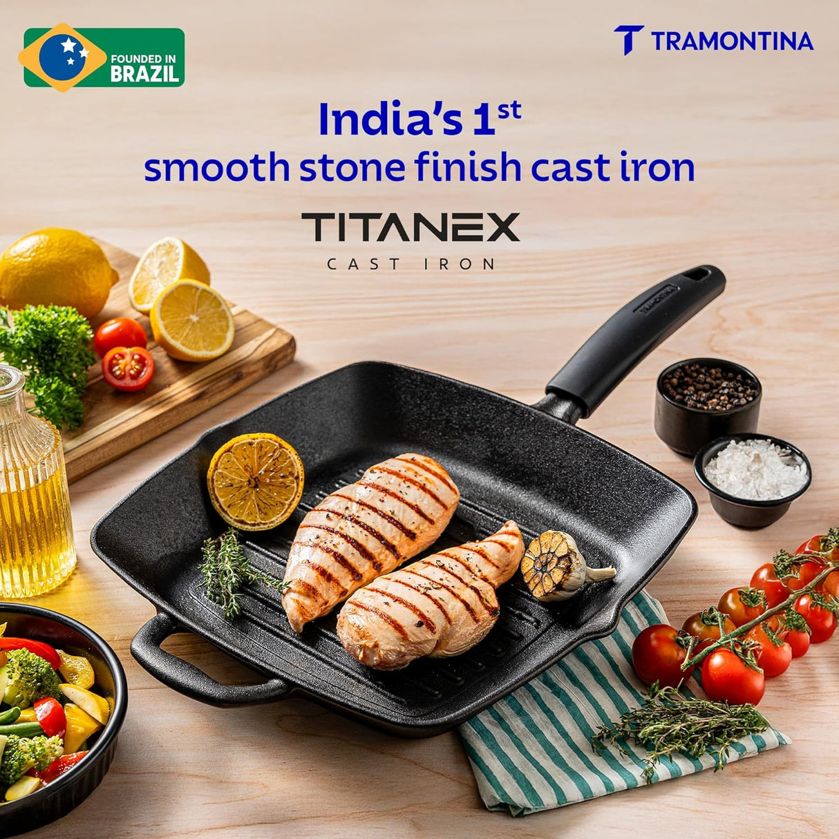 Tramontina India 27cm pre-seasoned cast iron grill pan with heat-resistant silicone grip, ideal for grilling.