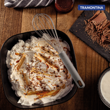 Grey Softta silicone whisk by Tramontina India, showing a close-up of the flexible, durable kitchen whisk with silicone-coated wires.