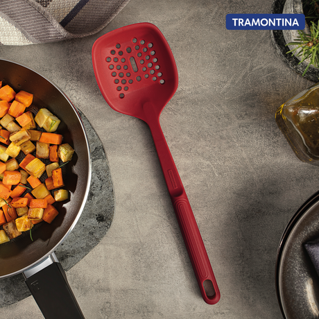 Red Softta Silicone Skimmer by Tramontina India with a wide silicone scoop and ergonomic handle for efficient cooking and straining.