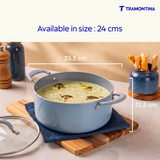 Blue Tramontina Stella Biryani Pot, 24 cm, with a stainless steel body and handles, ideal for preparing flavorful biryani dishes.