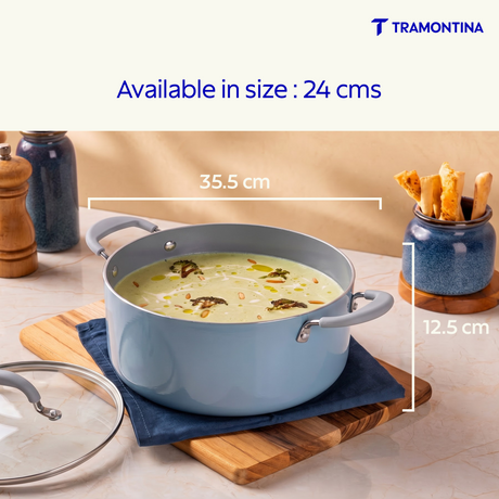Blue Tramontina Stella Biryani Pot, 24 cm, with a stainless steel body and handles, ideal for preparing flavorful biryani dishes.