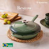 Tramontina India Bestow enameled cast iron 30cm fry pan with cactus green finish, featuring a lid and sturdy handles.