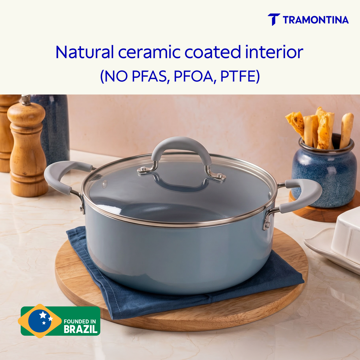 Blue Tramontina Stella Biryani Pot, 24 cm, showing a sturdy stainless steel cookware with a blue exterior and ergonomic handles.