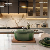 Tramontina India Bestow enameled cast iron oval Dutch oven in cactus green, 5.2L, showing its glossy exterior and sturdy handle.