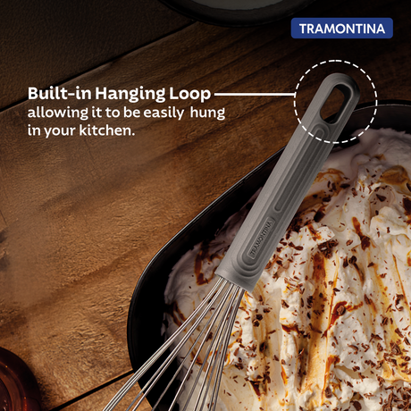 Grey Softta silicone whisk by Tramontina India with a comfortable handle and flexible silicone wires for cooking and baking.