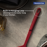 Red Softta Silicone Skimmer by Tramontina India with a wide silicone scoop and stainless steel handle for efficient cooking.