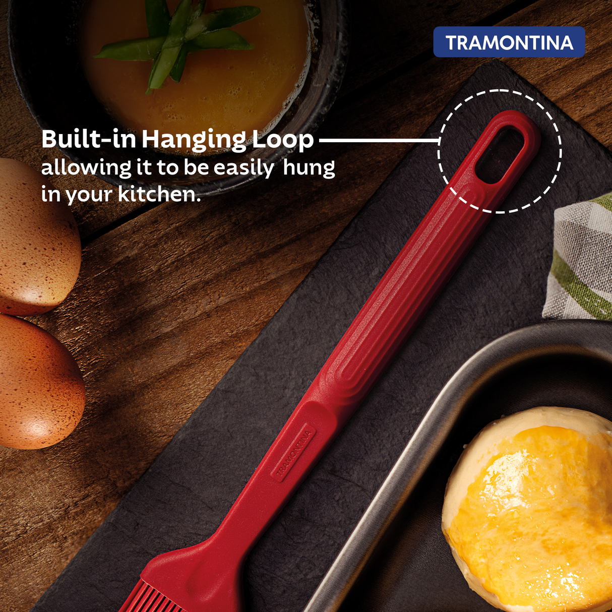 Red Softta silicone brush by Tramontina India, showing a close-up of the flexible, heat-resistant brush for cooking and baking.