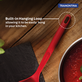 Red Softta silicone ladle by Tramontina India with a sturdy handle and flexible silicone scoop for soups and sauces.
