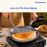 Blue Tramontina Stella Dosa Tawa, 28 cm non-stick skillet with flat surface for making dosas and other flatbreads.