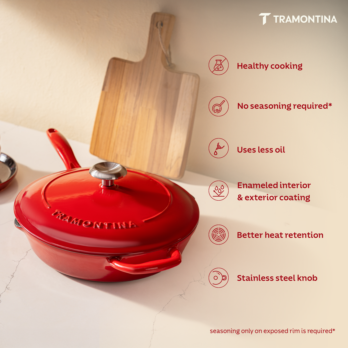 Tramontina India Bestow enameled cast iron 25cm red fry pan with lid, ideal for versatile cooking and heat retention.