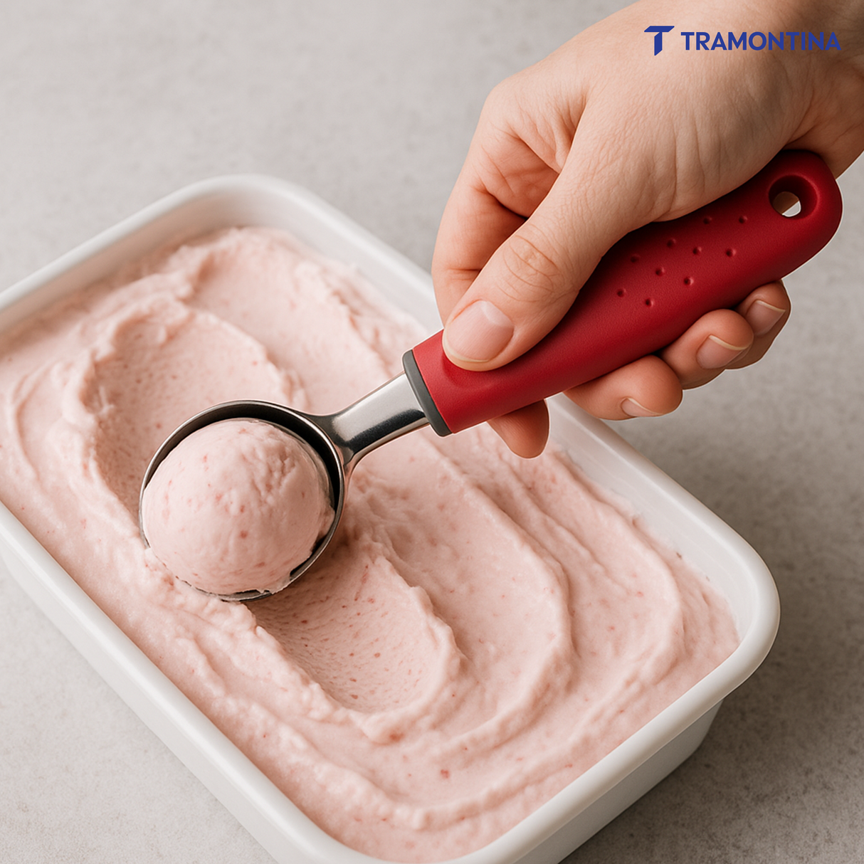 Utilitá ice cream scoop with stainless steel blade and red polypropylene handle