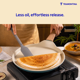 Tramontina Spectra Forged Dosa Tawa 28 cm, round non-stick pan with a black handle and textured cooking surface.