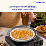 Blue Tramontina Stella Dosa Tawa 28 cm with non-stick surface, round shape, and flat cooking surface for making dosas.