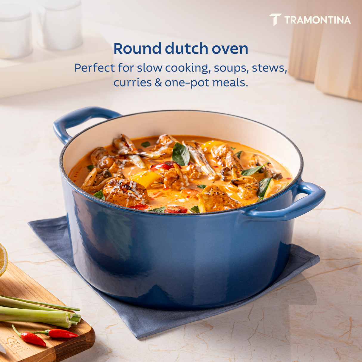 Medium blue enameled cast iron Dutch oven by Tramontina India, 6.1L round casserole suitable for hearty stews and baking.