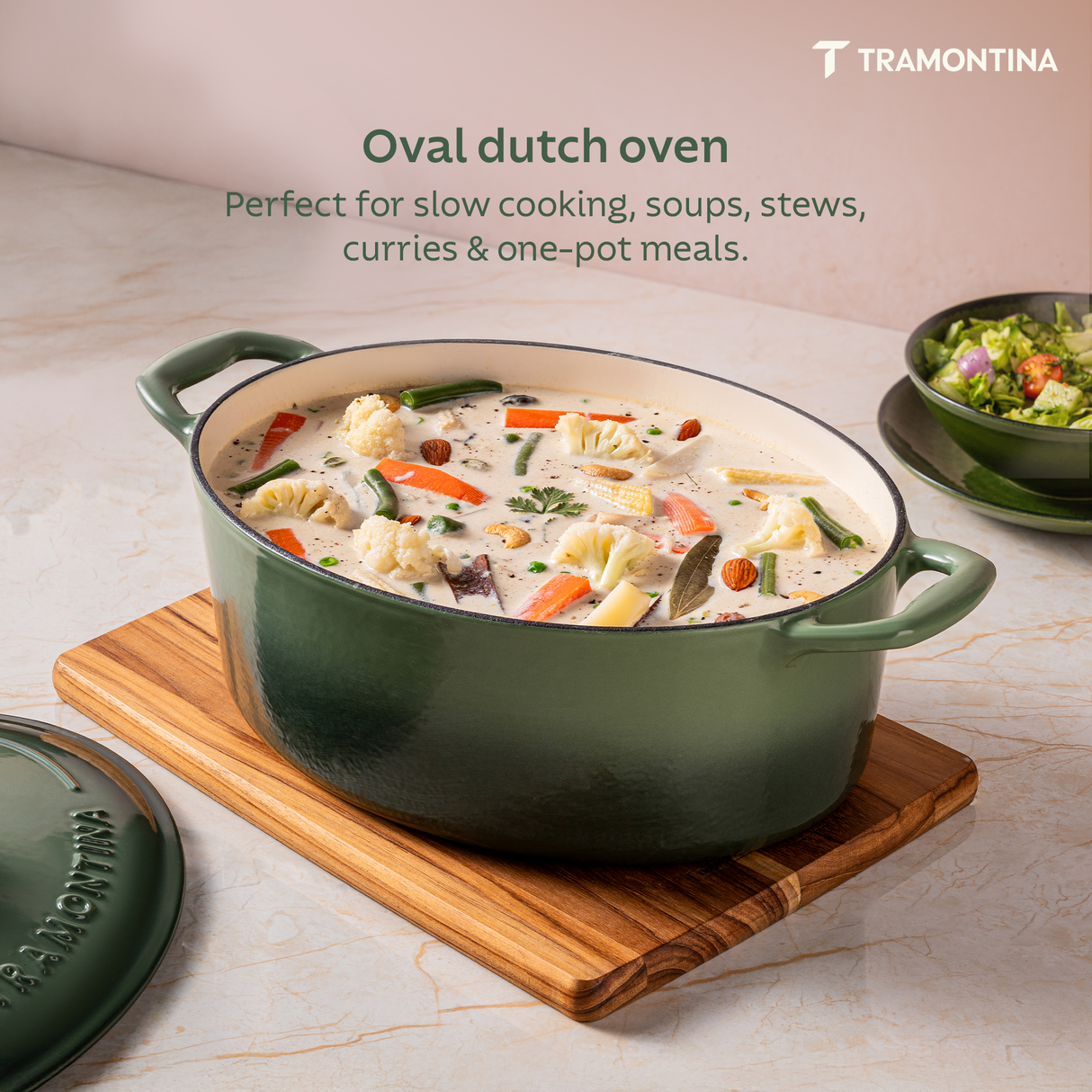 Tramontina India Bestow enameled cast iron oval Dutch oven in cactus green, 5.2L, with a glossy finish and sturdy handles.