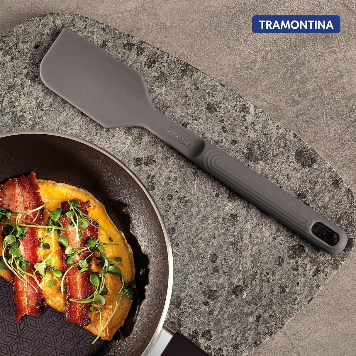 Tramontina India Softta silicone 3-piece utensil set with grey slotter turner, spatula, and spoon for cooking and baking.