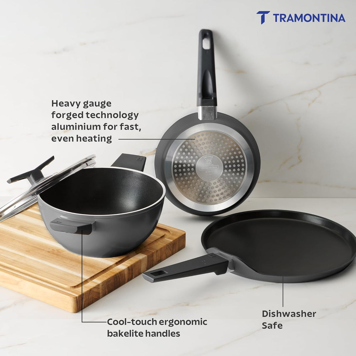 Set of four Tramontina India Chroma Forged CK cookware including 20cm fry pan, 28cm DosaTawa, and 22cm Kadai in grey.