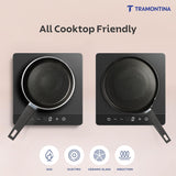 Tramontina India Chroma Forged cookware set with a 20cm fry pan and 28cm DosaTawa in grey, shown on a kitchen countertop.