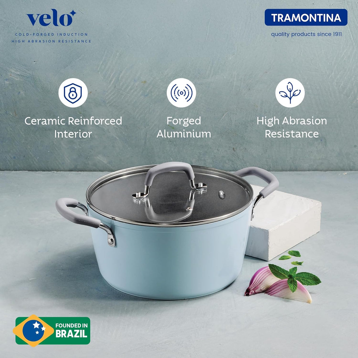 Tramontina India Velo Forged 24 cm sea-colored casserole with sturdy handles and a glass lid for versatile cooking.