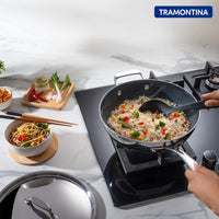 Fusao EX+ Triply Ceramic 26cm wok with stainless steel lid from Tramontina India, showing the ceramic-coated cooking surface and lid.