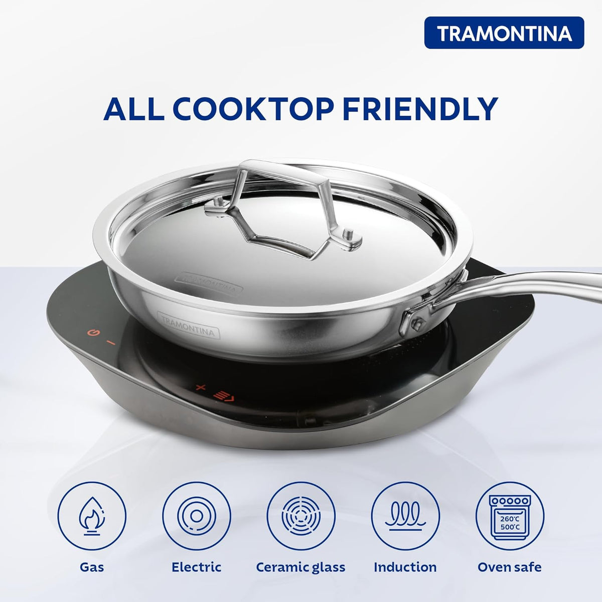 Tramontina India Fusao EX+ 24cm ceramic stainless steel tri-ply fry pan with lid, shown with a black handle and stainless steel lid.