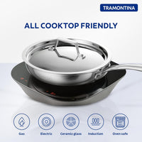 Tramontina India Fusao EX+ 24cm ceramic stainless steel tri-ply fry pan with lid, shown with a black handle and stainless steel lid.