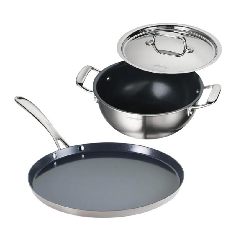 Tramontina India Fusao EX+ ceramic stainless steel tri-ply cookware set with 3.8L kadai and 30cm dosa tawa on a stovetop