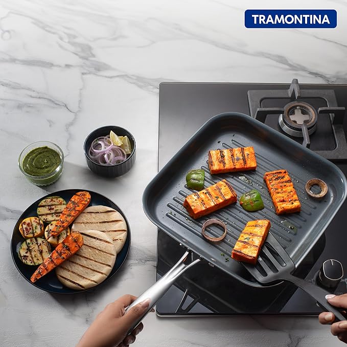 Tramontina India Fusao EX+ 26cm ceramic stainless steel tri-ply grill pan with ridged surface for grilling.
