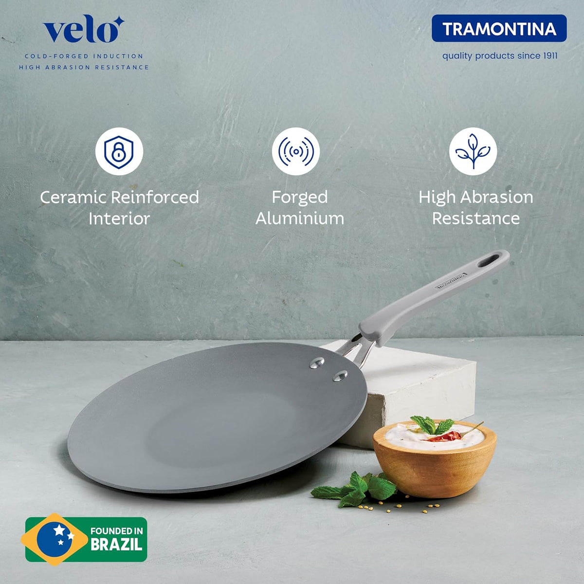 Velo Forged Concave Tawa 26 cm from Tramontina India, showing a durable, black concave griddle with a flat cooking surface.