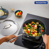Tramontina India Fusao EX+ 24cm triply ceramic deep sauté pan with stainless steel lid, showing the pan's ceramic coating and lid.