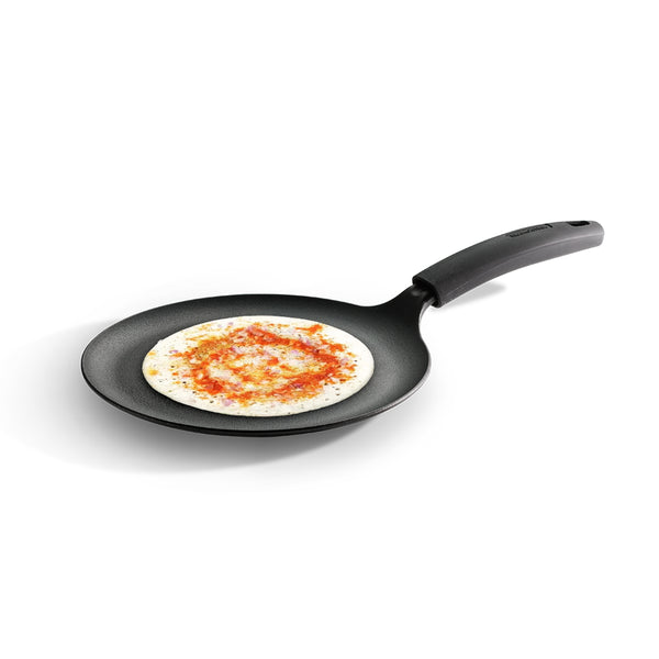 Titanex 24cm pre-seasoned cast iron dosa tawa with heat-resistant silicone grip for even cooking and easy handling.