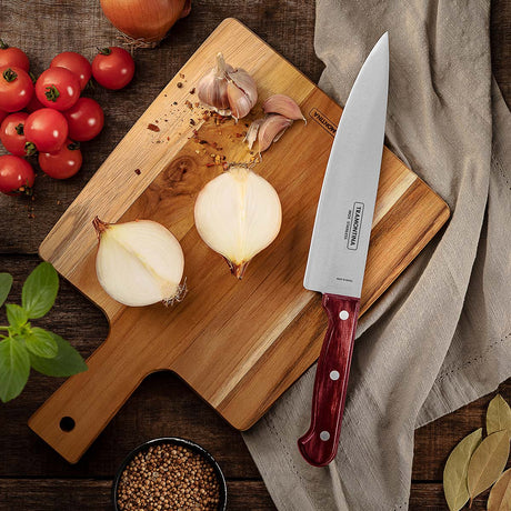 Red Tramontina India Polywood 6-inch stainless steel chef knife with impact and heat-resistant wooden handle, straight back blade.