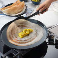 Tramontina India Fusao EX+ 28cm ceramic stainless steel tri-ply Tawa for dosa cooking, 4mm thick, with a smooth cooking surface.