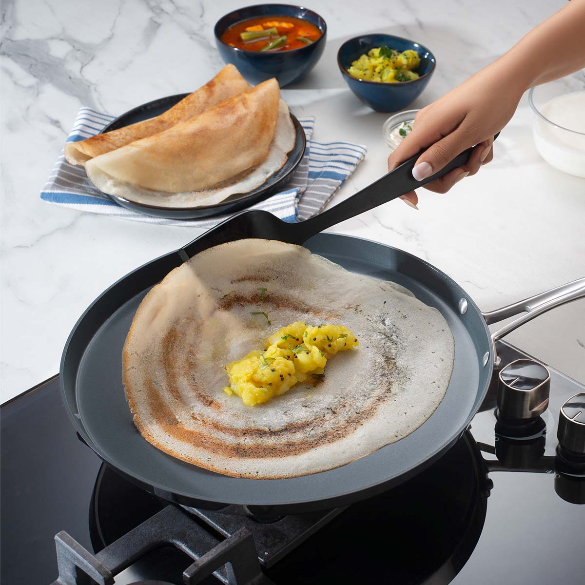 Tramontina India Fusao EX+ 30cm ceramic stainless steel tri-ply dosa tawa with 4mm thickness, flat cooking surface for dosa and more.