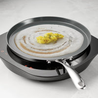 Tramontina India Fusao EX+ 28cm ceramic stainless steel tri-ply dosa tawa with 4mm thickness, round cooking surface.